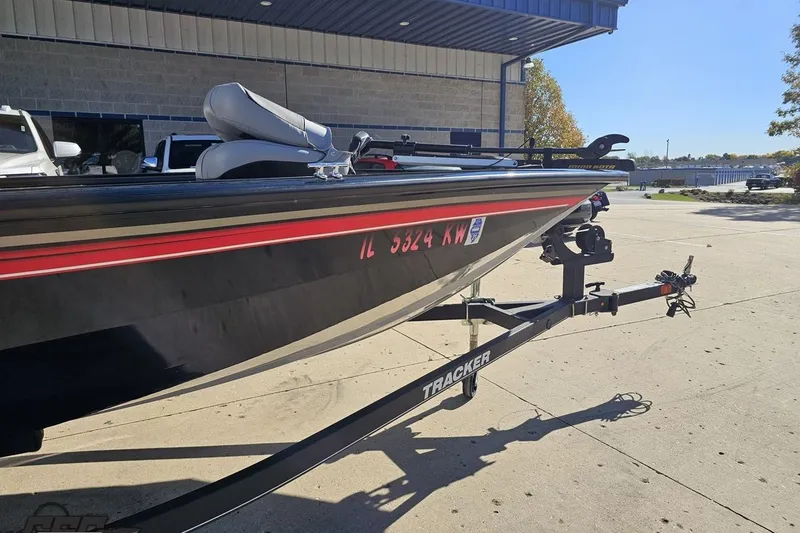 Slide: The Image of 2018 Tracker Pro Team 175 TXW boat on trailer, parked outdoors. - 4
