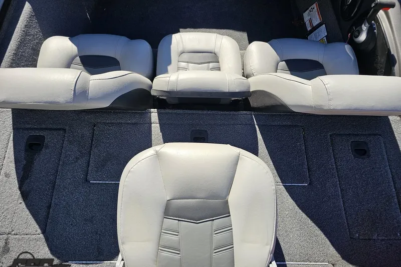Slide: The Image of 2018 Tracker Pro Team 175 TXW boat interior with gray seating and carpeted flooring. - 43
