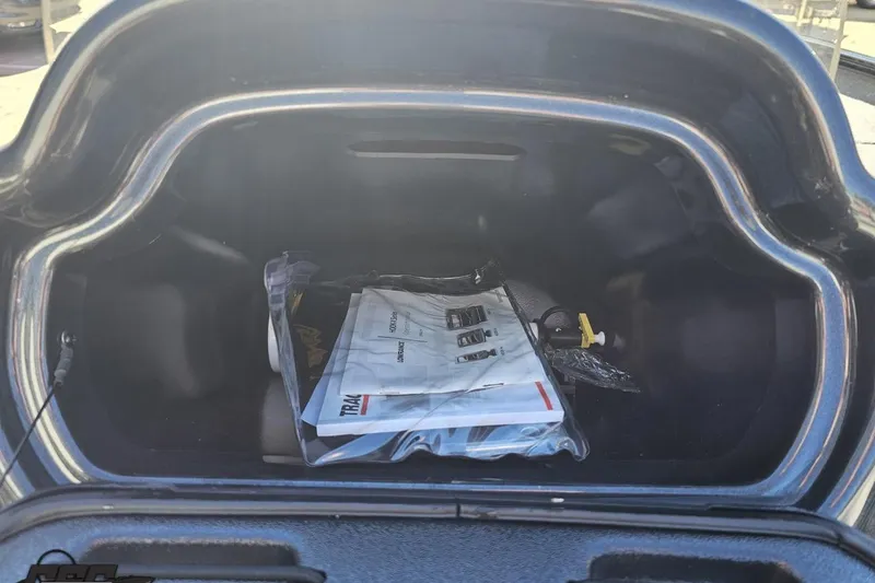 Slide: The Image of Open trunk of a 2018 Tracker Pro Team 175 TXW with documents inside. - 49