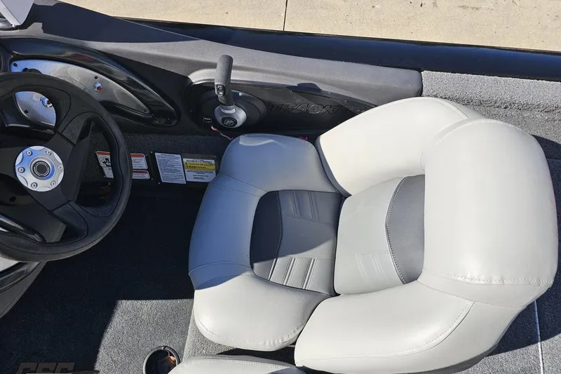 Slide: The Image of 2018 Tracker Pro Team 175 TXW boat interior with steering wheel and seat. - 51