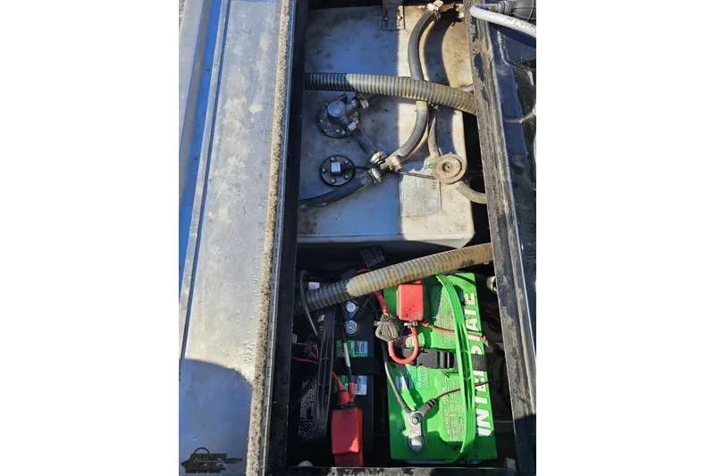 Slide: The Image of 2018 Tracker Pro Team 175 TXW boat battery compartment with wiring and connections. - 67