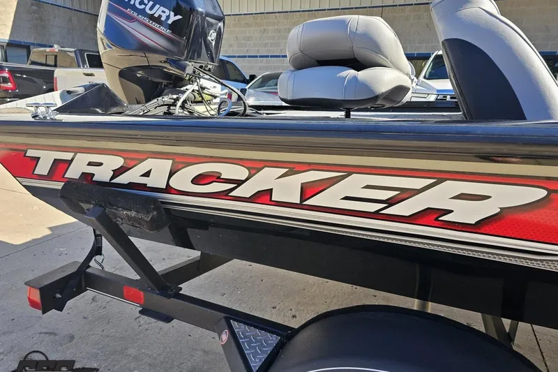 Slide: The Image of 2018 Tracker Pro Team 175 TXW boat with Mercury engine, parked on a trailer. - 7