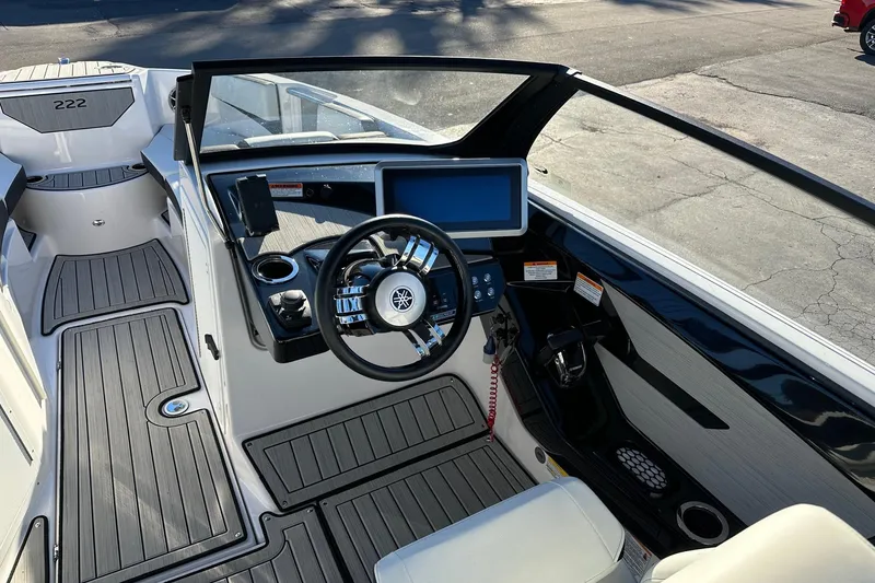 Slide: The Image of 2024 Yamaha Boats 222SD cockpit with modern steering and dashboard controls. - 6