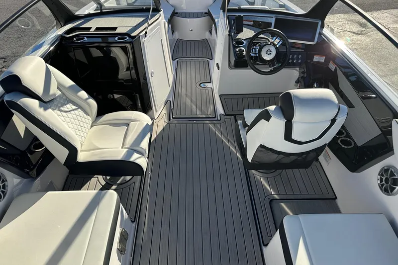 Slide: The Image of 2024 Yamaha Boats 222SD interior with modern seating and sleek dashboard design. - 7