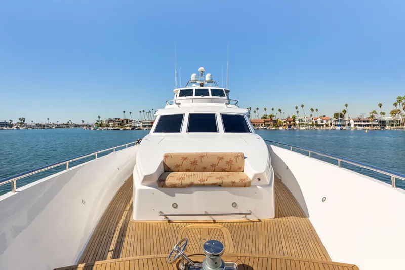 Slide: The Image of A 2005 Custom boat with Yamaha motor docked by waterfront homes. - 17