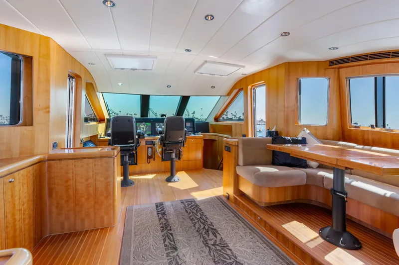 Slide: The Image of Luxurious yacht helm with advanced navigation systems, featuring leather chairs and panoramic windows. - 25