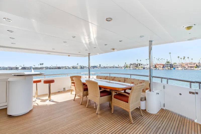 Slide: The Image of Luxurious yacht deck with dining area, overlooking waterfront homes, 2005 Custom model. - 32