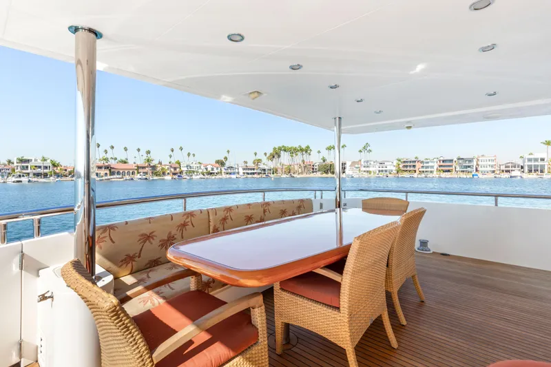 Slide: The Image of Luxury yacht deck with dining area, wicker chairs, and ocean view, 2005 Custom model. - 33