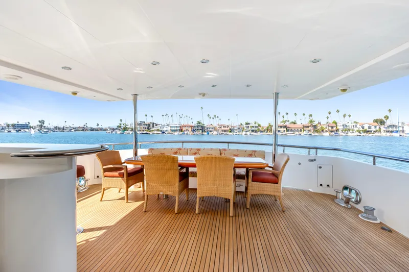 Slide: The Image of Luxurious yacht interior with plush seating, wooden accents, and large windows overlooking the ocean. - 35
