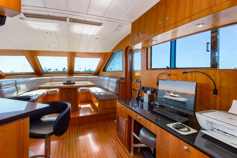 Slide: The Image of Luxurious yacht interior with modern kitchen, bar stools, and large stainless steel refrigerator, 2005 Custom. - 47