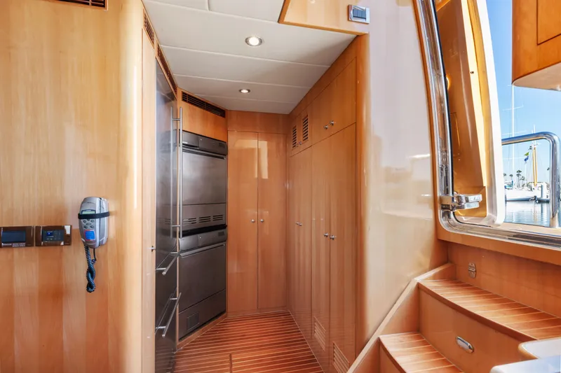 Slide: The Image of Modern bathroom with granite countertop, stainless steel sink, and glass shower in a 2005 Custom model. - 67