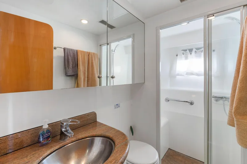 Slide: The Image of Luxurious yacht kitchen interior with wooden cabinetry and modern appliances, 2005 C Custom model. - 69