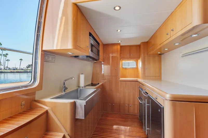 Slide: The Image of Engine room of a 2005 Custom model, featuring insulated pipes and control panels. - 71