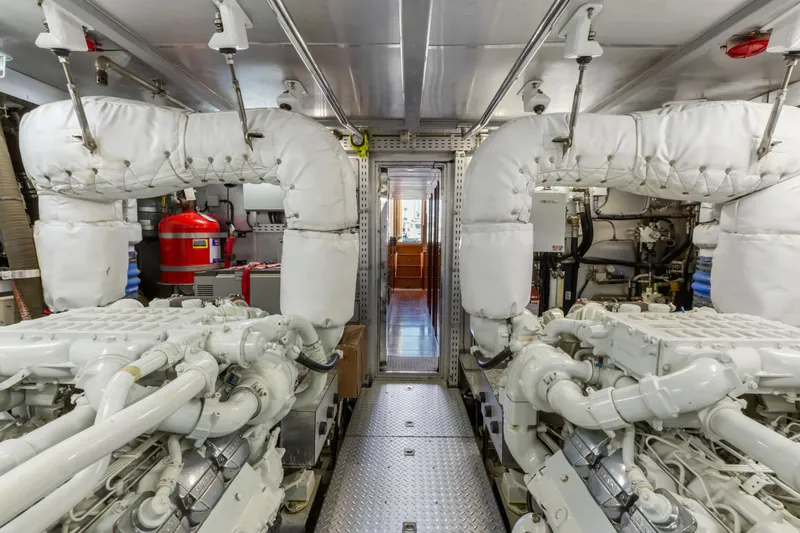 Slide: The Image of Engine room with advanced machinery and control panels, featuring a 2005 C Custom model. - 75
