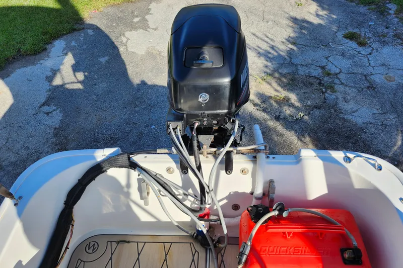 Slide: The Image of 2020 Boston Whaler 110 Sport boat engine and fuel tank setup. - 13