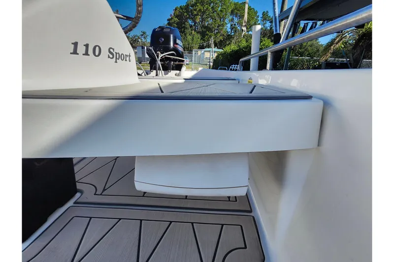 Slide: The Image of 2020 Boston Whaler 110 Sport boat interior with visible deck and seating. - 17