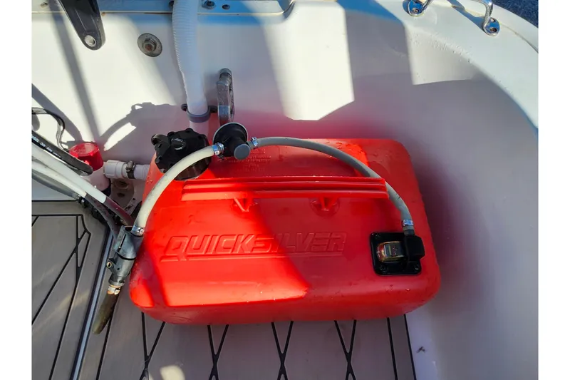 Slide: The Image of Red Quicksilver fuel tank in a 2020 Boston Whaler 110 Sport boat. - 18