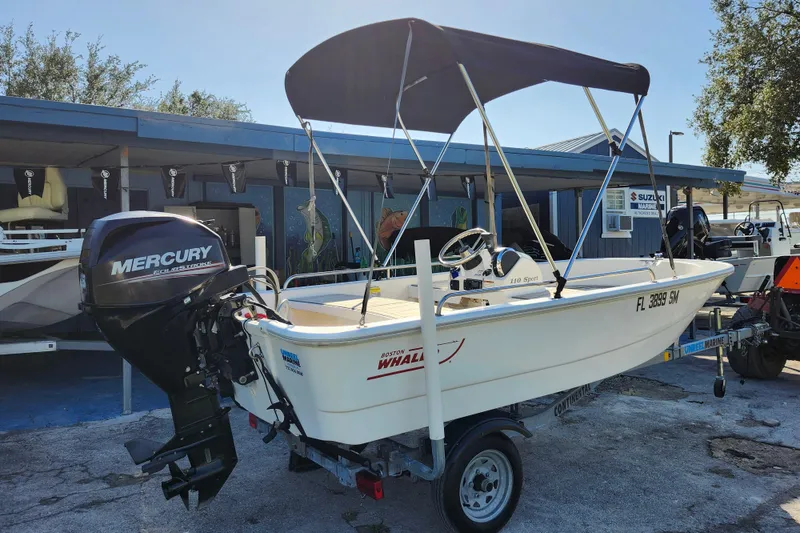 Slide: The Image of 2020 Boston Whaler 110 Sport boat with Mercury engine on trailer. - 6
