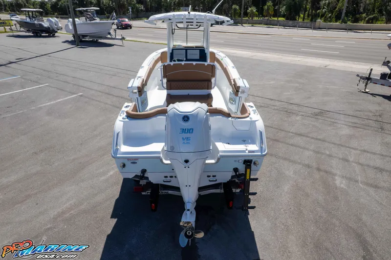 Slide: The Image of 2026 Sea Hunt Ultra 255 SE boat with Yamaha 300 V6 engine, parked on asphalt. - 11