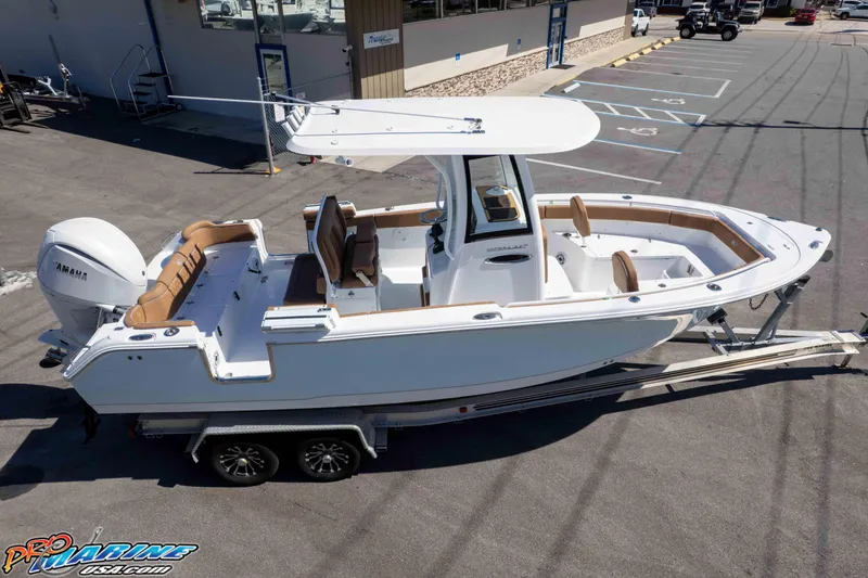 Slide: The Image of 2026 Sea Hunt Ultra 255 SE boat on trailer, parked in a lot. - 18