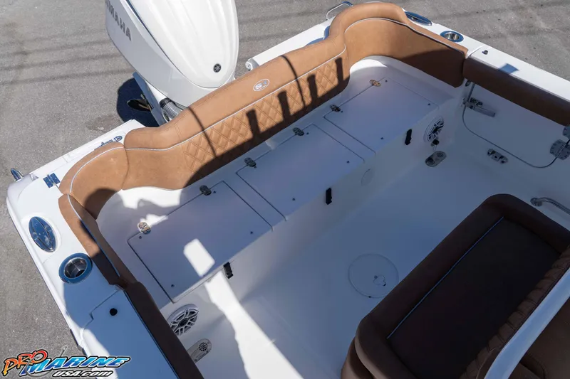 Slide: The Image of 2026 Sea Hunt Ultra 255 SE boat interior with tan seating and Yamaha engine. - 29