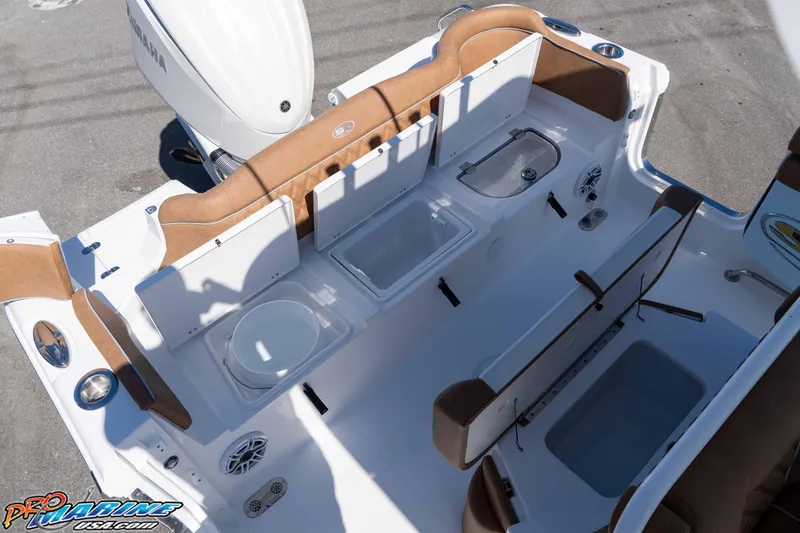 Slide: The Image of 2026 Sea Hunt Ultra 255 SE boat interior with seating and storage compartments. - 30
