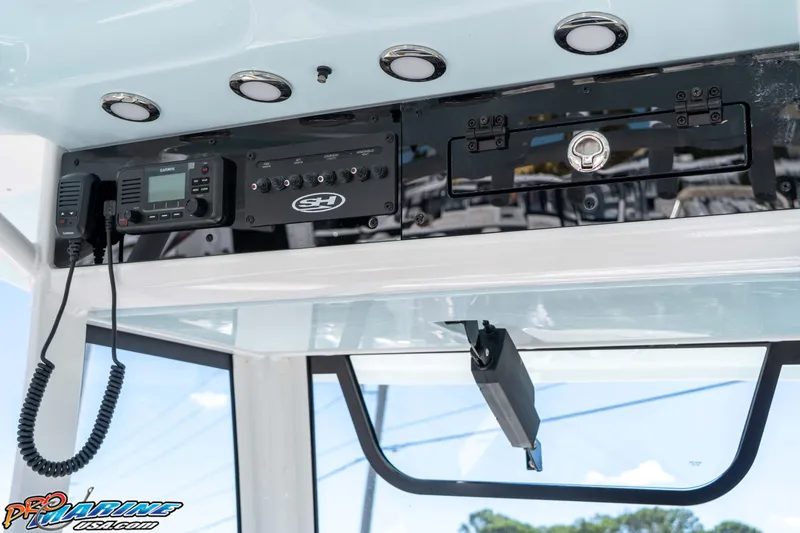 Slide: The Image of 2026 Sea Hunt Ultra 255 SE boat console with Garmin radio and control panel. - 38