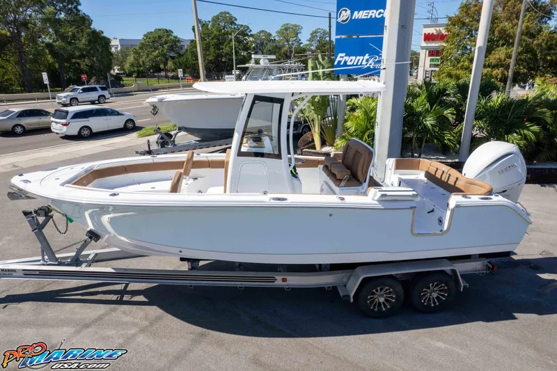 Slide: The Image of 2026 Sea Hunt Ultra 255 SE boat on trailer at dealership. - 5