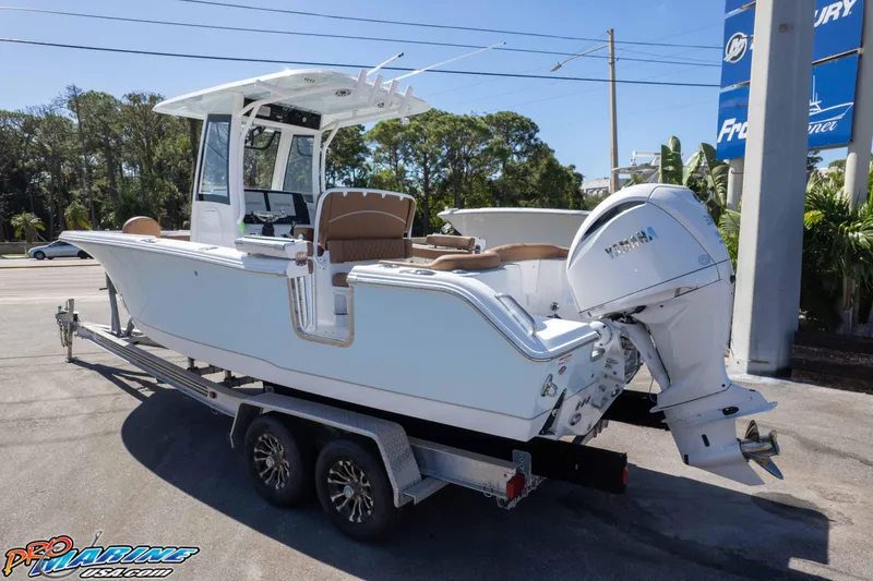 Slide: The Image of 2026 Sea Hunt Ultra 255 SE boat on trailer, featuring Yamaha outboard motor. - 7