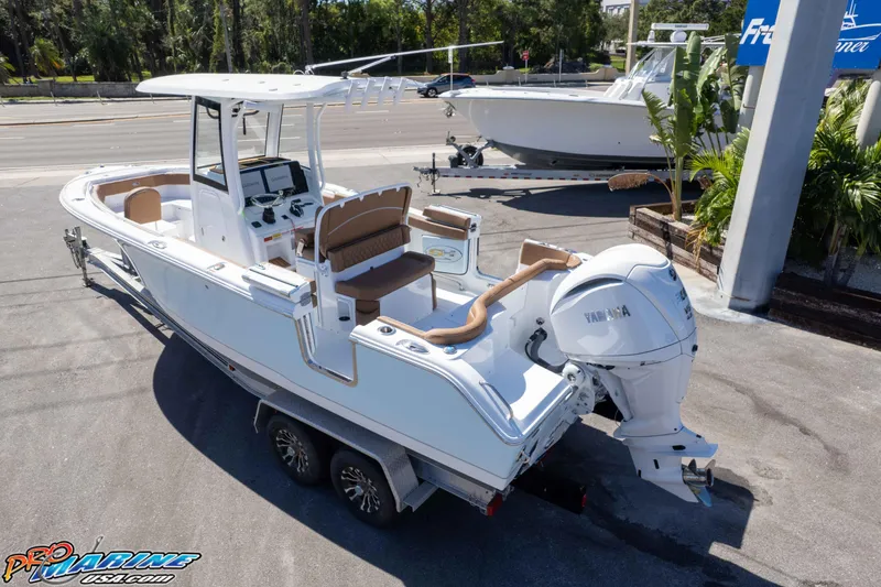 Slide: The Image of 2026 Sea Hunt Ultra 255 SE boat on trailer, featuring Yamaha outboard motor. - 8