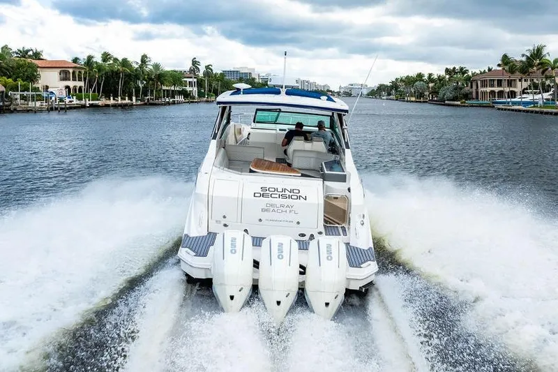 Slide: The Image of 2021 Sea Ray Sundancer 320 Outboard cruising on a scenic waterway. - 12