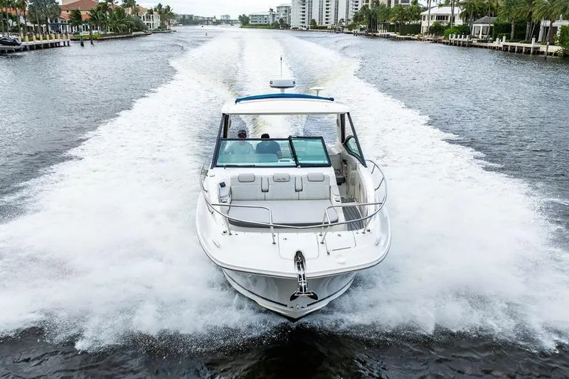 Slide: The Image of 2021 Sea Ray Sundancer 320 Outboard cruising on a scenic waterway. - 17