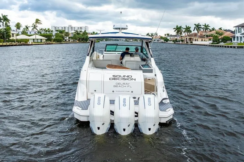 Slide: The Image of 2021 Sea Ray Sundancer 320 Outboard cruising on a scenic waterway. - 2