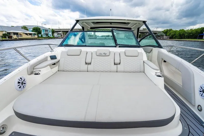 Slide: The Image of 2021 Sea Ray Sundancer 320 Outboard boat interior with spacious seating and scenic water view. - 21