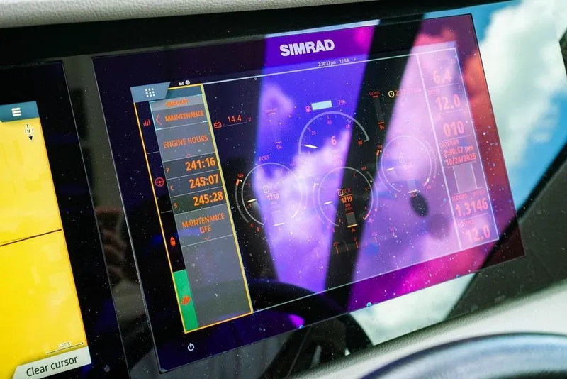 Slide: The Image of Simrad display on 2021 Sea Ray Sundancer 320 Outboard showing engine and maintenance data. - 24
