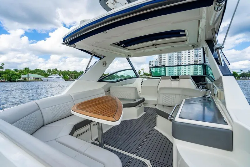 Slide: The Image of 2021 Sea Ray Sundancer 320 Outboard interior with elegant seating and waterfront view. - 33