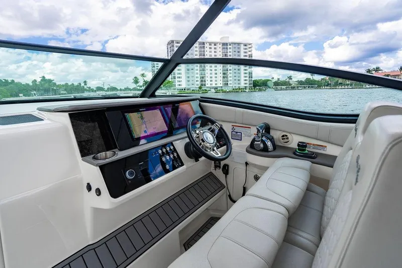 Slide: The Image of 2021 Sea Ray Sundancer 320 Outboard cockpit with modern navigation system and luxurious seating. - 37