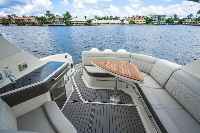Slide: The Image of Luxurious 2021 Sea Ray Sundancer 320 Outboard boat interior with elegant seating and scenic water view. - 44