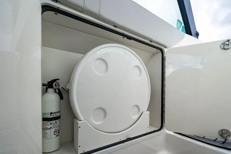 Slide: The Image of Storage compartment on 2021 Sea Ray Sundancer 320 Outboard with fire extinguisher. - 45