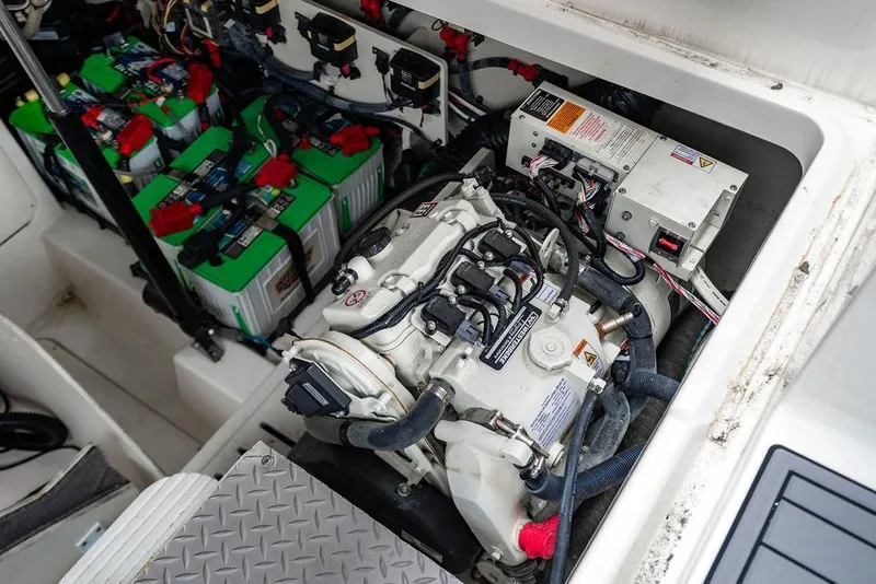 Slide: The Image of Engine compartment of 2021 Sea Ray Sundancer 320 Outboard with batteries and wiring. - 52