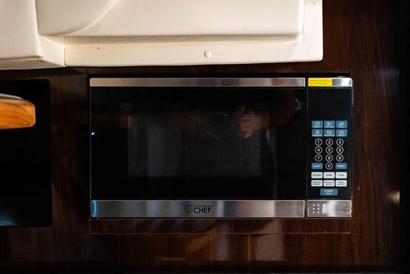 Slide: The Image of Microwave oven in 2021 Sea Ray Sundancer 320 Outboard yacht kitchen. - 55