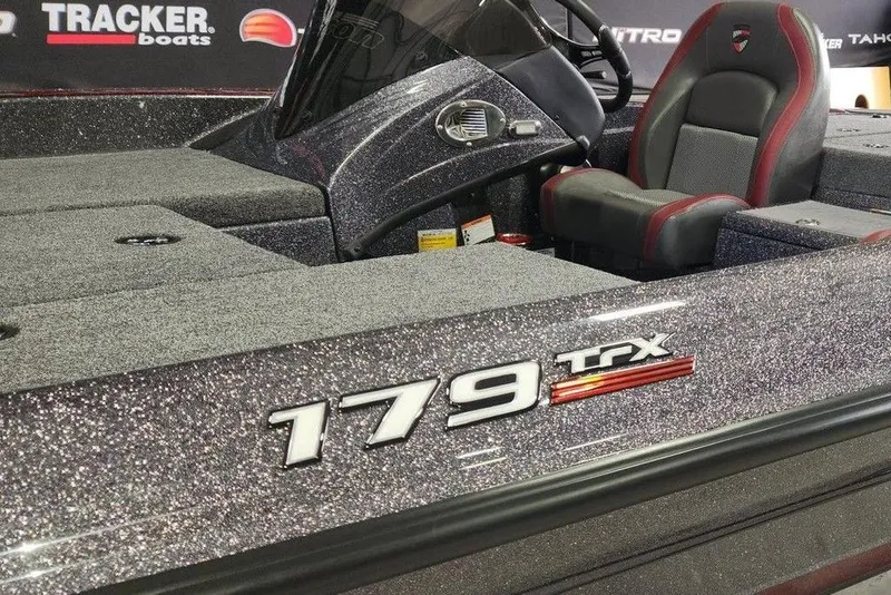 Slide: The Image of 2026 Triton 179 TrX boat interior with glitter finish and comfortable seating. - 11