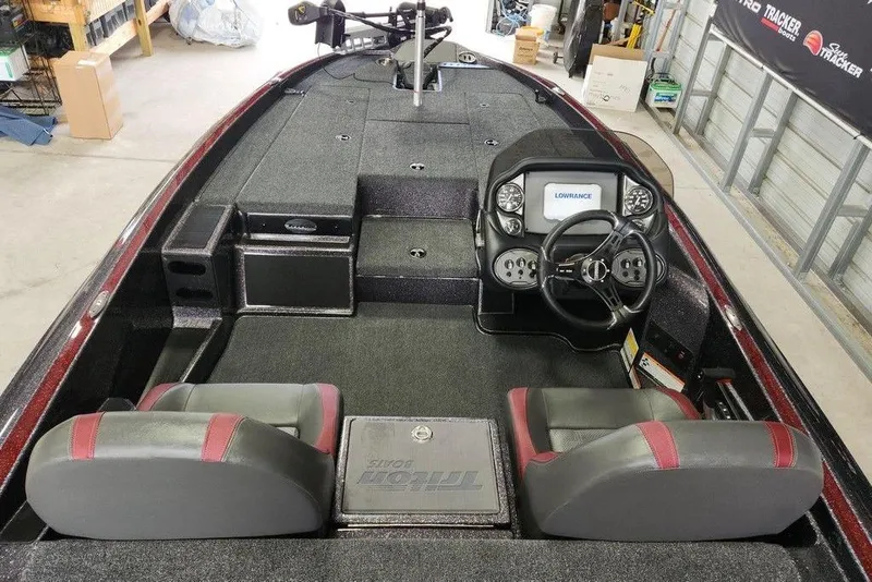Slide: The Image of 2026 Triton 179 TrX boat interior with dual seats and advanced dashboard controls. - 12