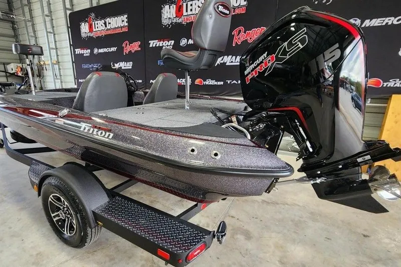 Slide: The Image of 2026 Triton 179 TrX boat with Mercury Pro XS engine in showroom. - 2