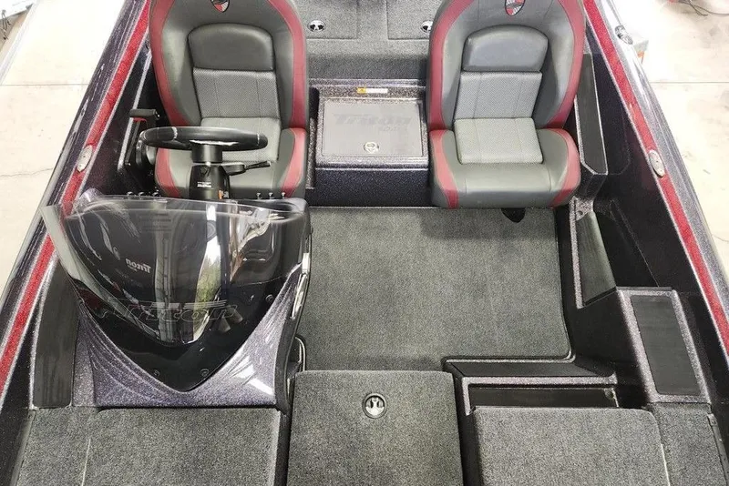 Slide: The Image of 2026 Triton 179 TrX boat interior with dual seats and steering console. - 8