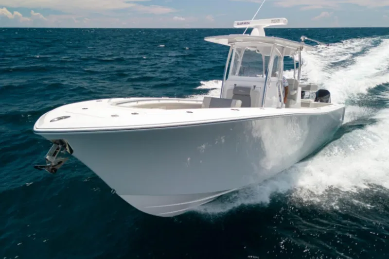 The Image of 2026 Front Runner 33' Center Console boat cruising on open ocean waters. - 1
