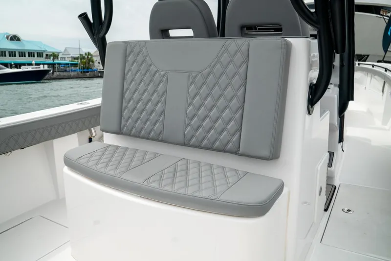 Slide: The Image of 2026 Front Runner 33' Center Console boat with luxurious gray seating. - 11