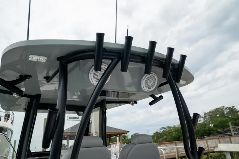 Slide: The Image of 2026 Front Runner 33' Center Console boat with rod holders and speakers on the T-top. - 13