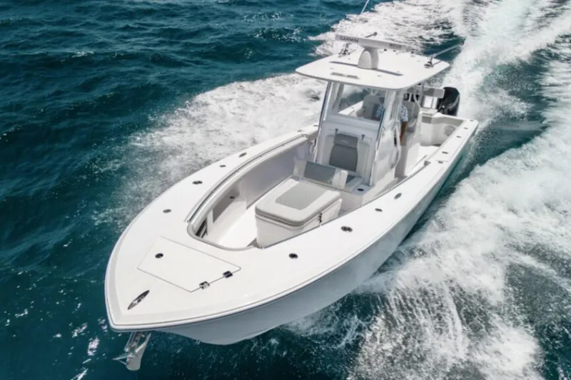 Slide: The Image of 2026 Front Runner 33' Center Console boat cruising on open water. - 2