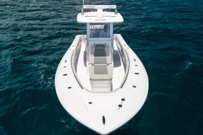 Slide: The Image of 2026 Front Runner 33' Center Console boat on open water. - 3